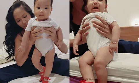 Con gái 5 tháng tuổi của Hoa hậu H'Hen Niê đeo vàng bạc đầy người, biểu cảm hài hước khi đi giày cao gót